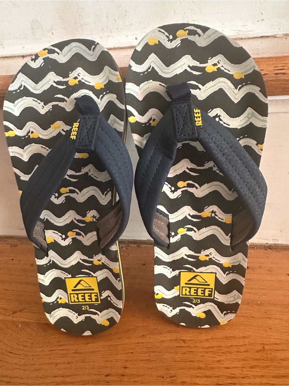 Reef Kids' Navy Flip Flops with Yellow Accent